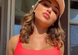 The beautiful Ana Cheri lowers her flirty swimsuit a bit