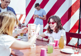 stylish people charming brunette female keeping smile her face while looking jenga game1