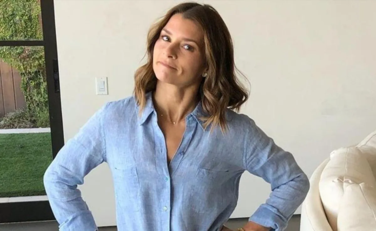 Danica Patrick displays her love of crossfit games by participating in the VIP area Danica Patrick smiles at home