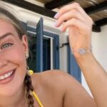 Bethany Lily April dazzles her fans with her low-cut white dress on Instagram Image 1 1