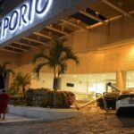 A car is damaged by lightning strikes as people stand outside a hotel after the earthquake in Acapulco Guerrero state Mexico.