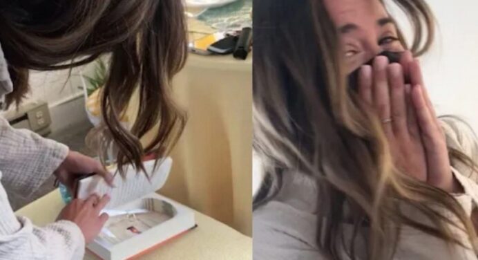 A young man proposes to his girlfriend while concealing the ring inside a Harry Potter book.