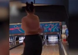 Woman performs a strike and celebrates it by doing an incredible split