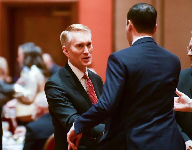Sen. James Lankford talks with guests during an event Saturday at Embassy Suites in Norman.
