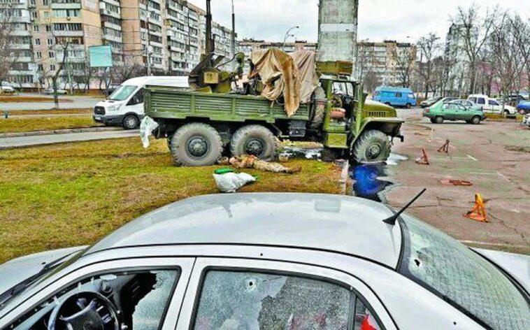 Bodies of Russian soldiers dressed in enemy uniforms lie in the streets of the capital.