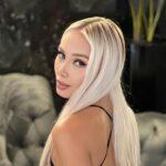 Daniella Chavez from the back and profile in a mini beach dress