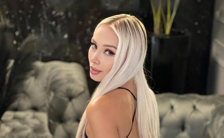 Daniella Chavez from the back and profile in a mini beach dress