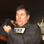 Matthew Chance a CNN correspondent in Kiev put on a bulletproof vest after being surprised by the explosions