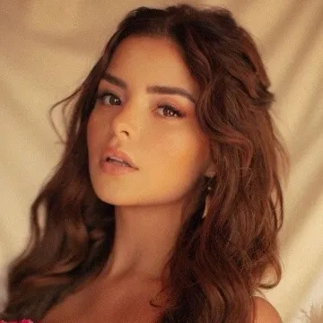 Demi Rose boasts a voluptuous figure with a risky bikini
