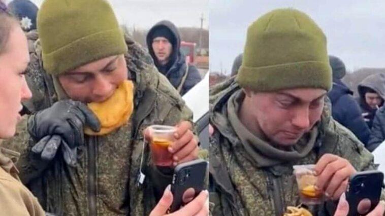 A young Russian soldier gives up and some Ukrainians feed him and make him call home