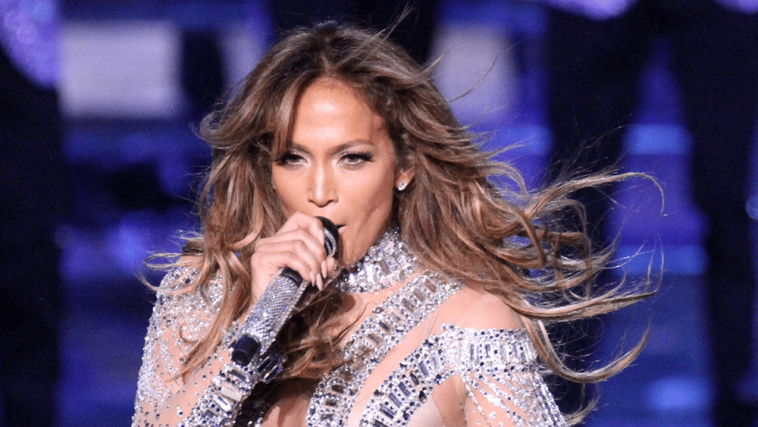 Jennifer Lopez takes off her coat and wears a lace bralette at 52 Jennifer Lopez