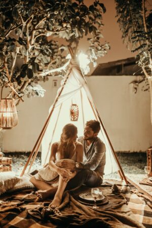 More collagen! The benefits of having sex that instantly rejuvenate your skin couple sitting inside tepee hut with lights