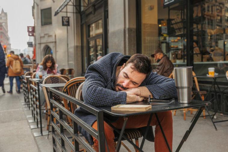 medium shot man sleeping table