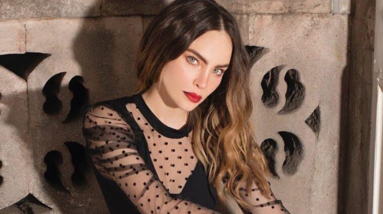 Belinda raises the temperature with a hot look with a plunging neckline and daring boots Belinda shows off her figure with a micro swimsuit lying on the sand VIDEO