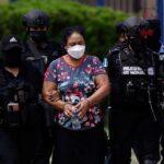 Honduran Officials Escort Herlinda Bobadilla Whose Extradition The United States Has Requested.