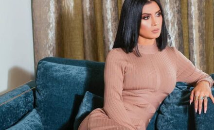 Kimberly Flores in a skin colored dress
