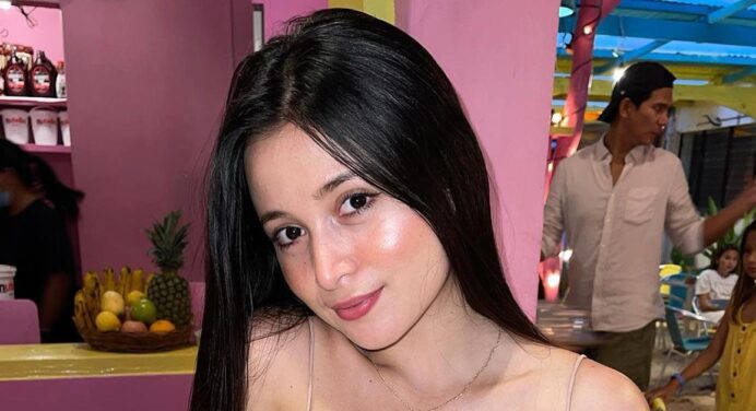 Pandora Kaaki models wearing a translucent robe, in her bedroom