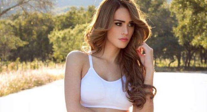 Yanet Garcia holds a heart-shaped thong while posing topless