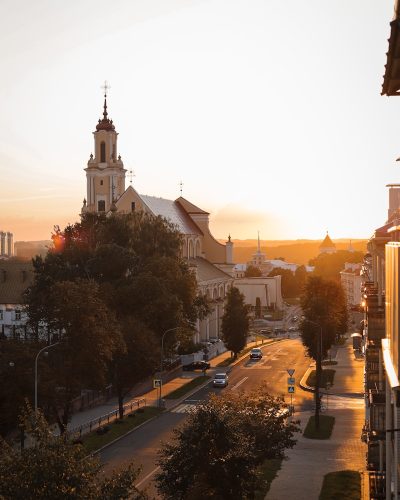 a street with cars and buildings on the side