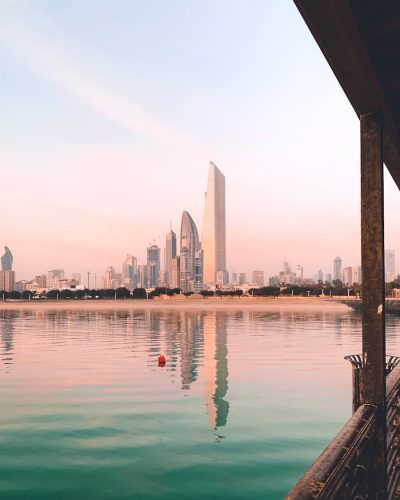 a body of water with a city in the background